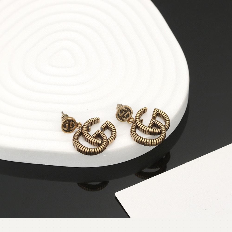G*u*i earrings
